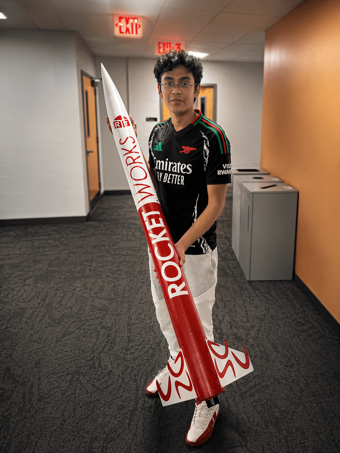 Aahan Desai holding the AeroNU rocket